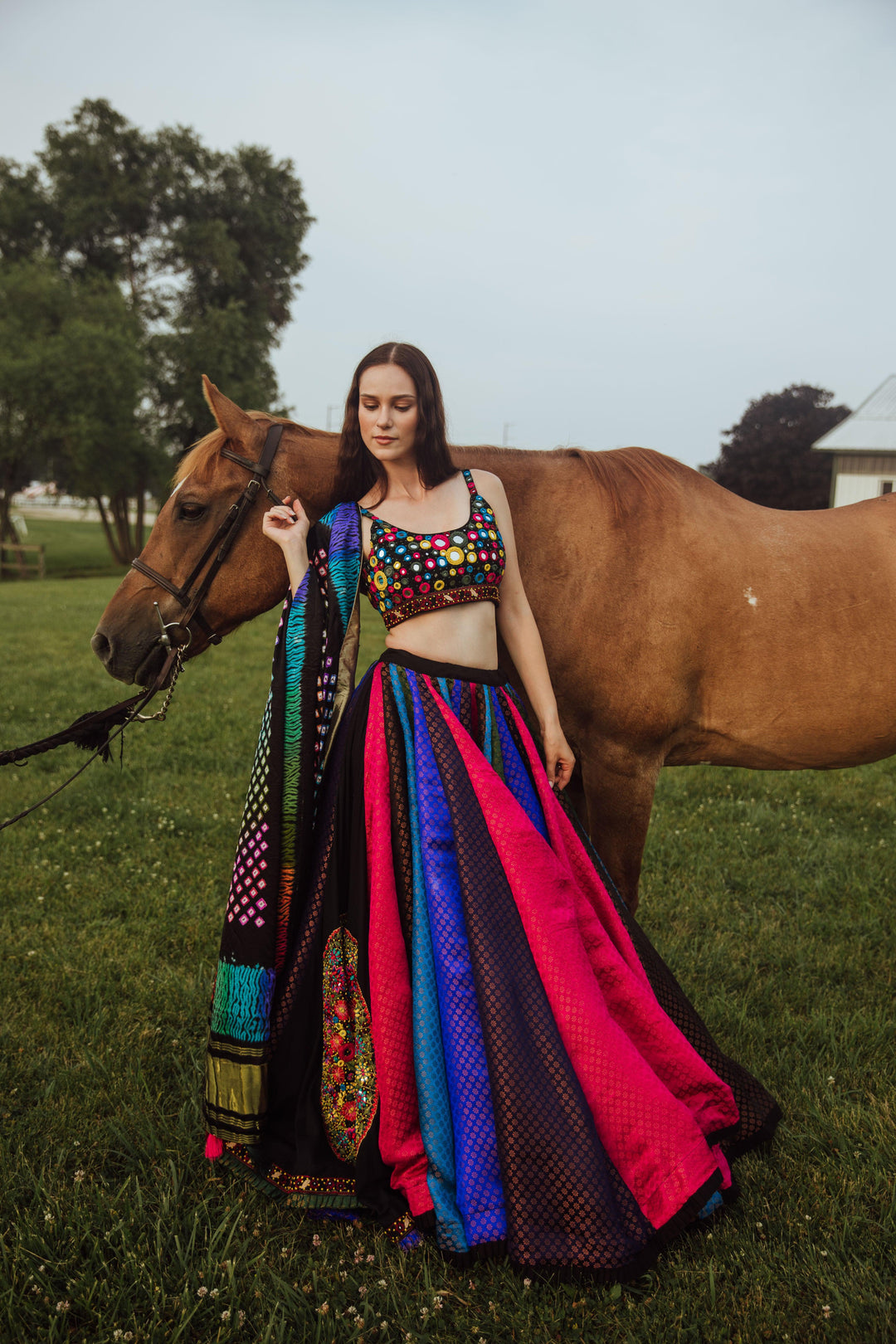 front closeup photo of a model showcasing raas multicolor mirror work chaniya choli set