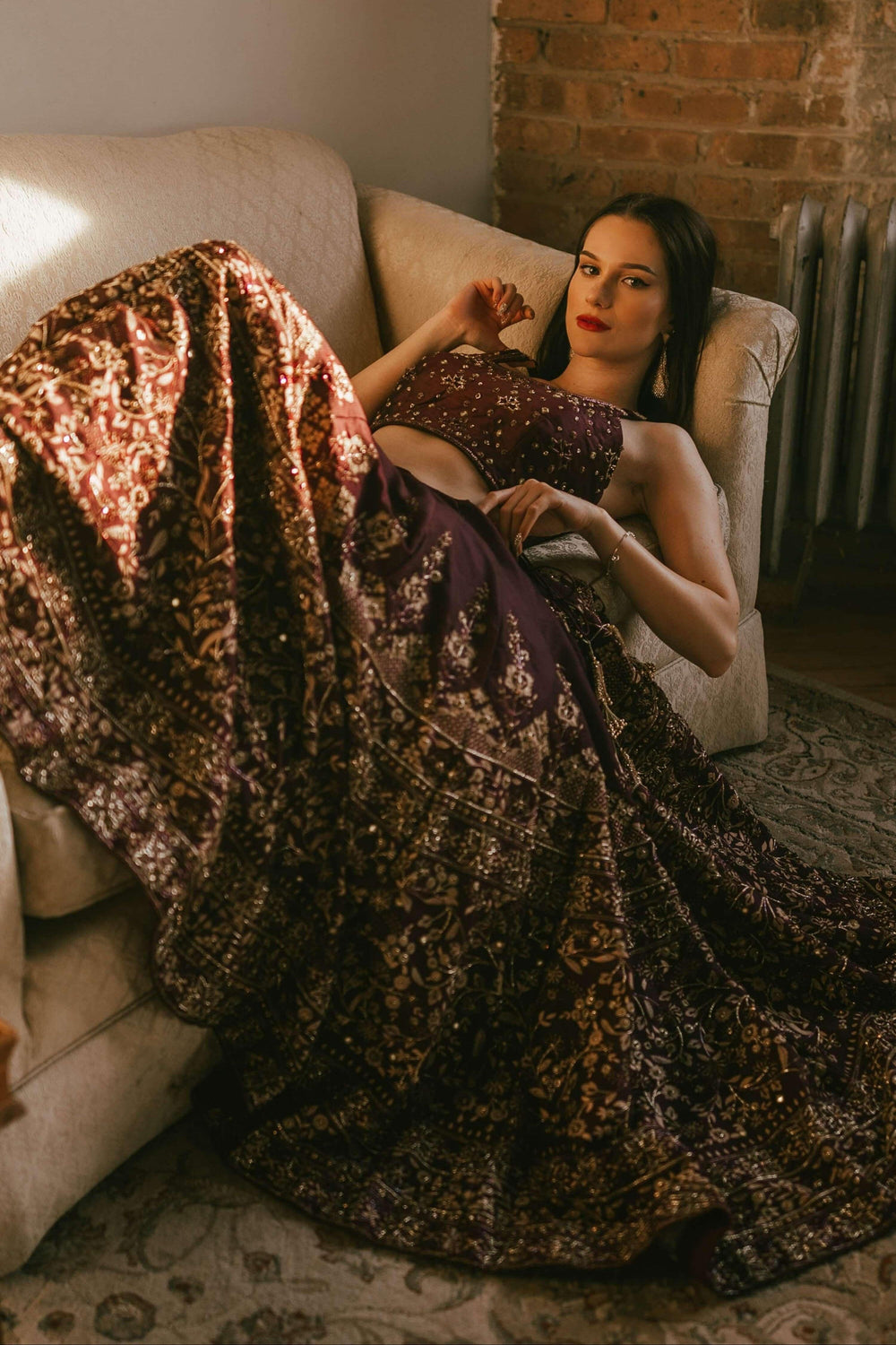 Wine bridal lehenga choli showing hand embroidery on the blouse