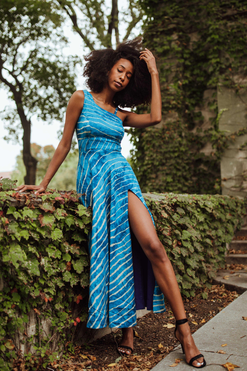 Blue rayon one-shoulder maxi dress with white leheriya stripe print and high side slit.