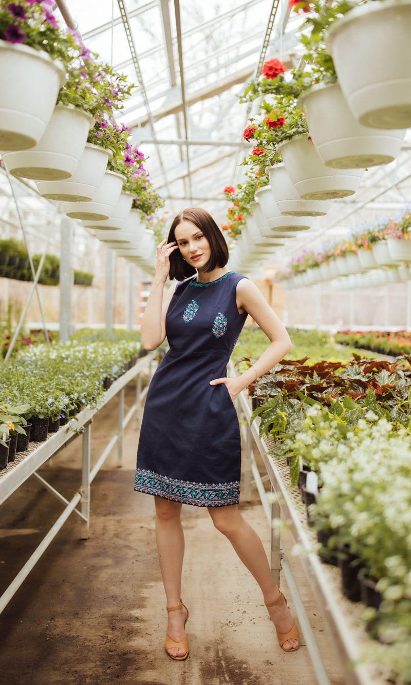 Navy cotton mini dress with hand block-printed patterns on neckline, torso, and hem.