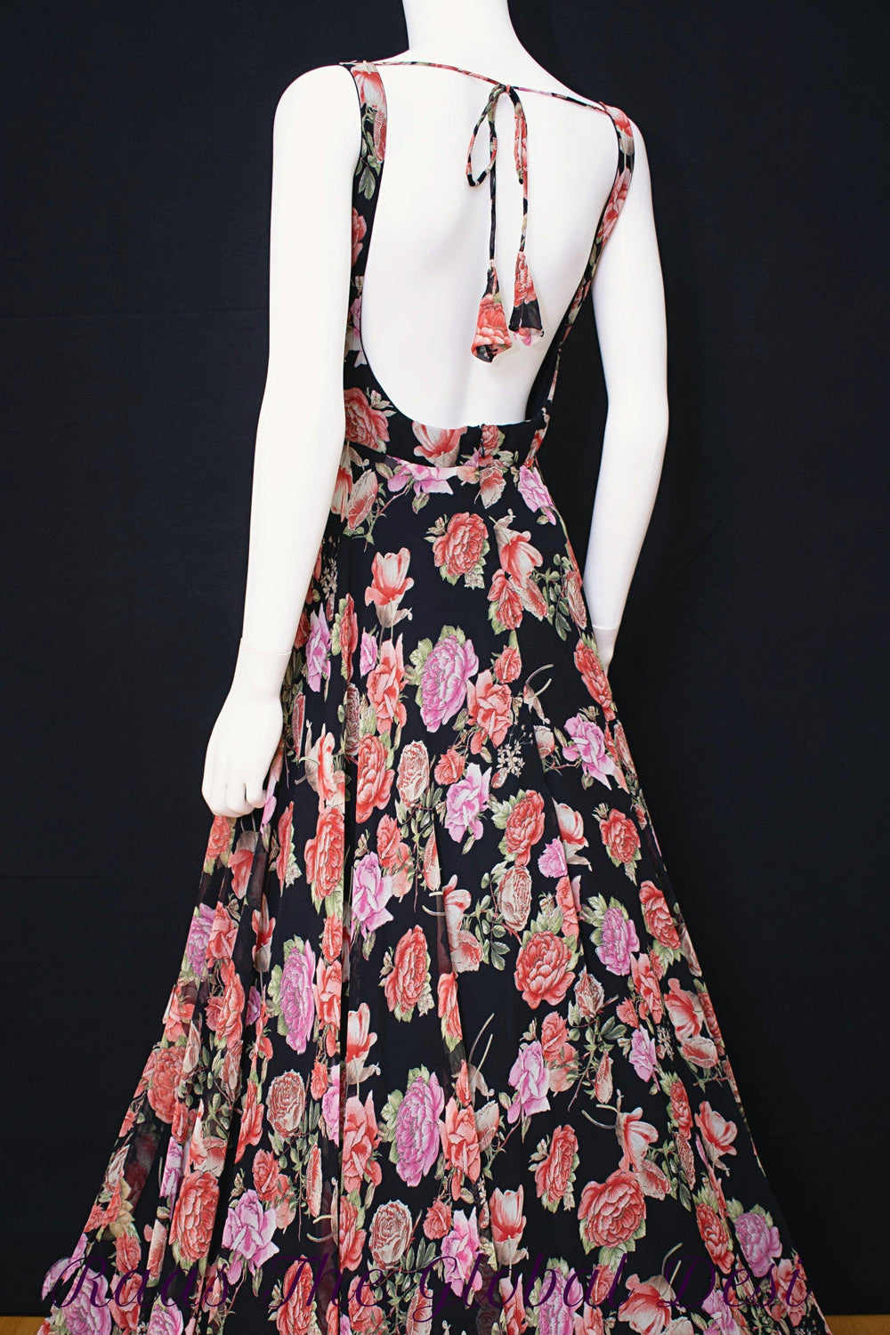 Georgette floral print long dress with back zipper and string tie, featuring magenta and purple ikat-inspired motifs.