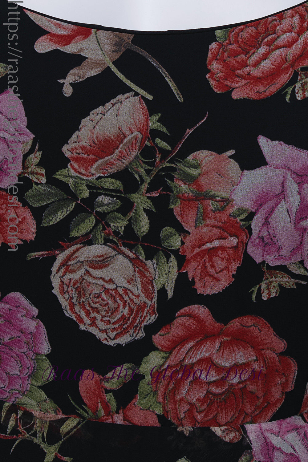 Black georgette long dress with vibrant magenta and purple ikat-inspired floral print and square neckline.