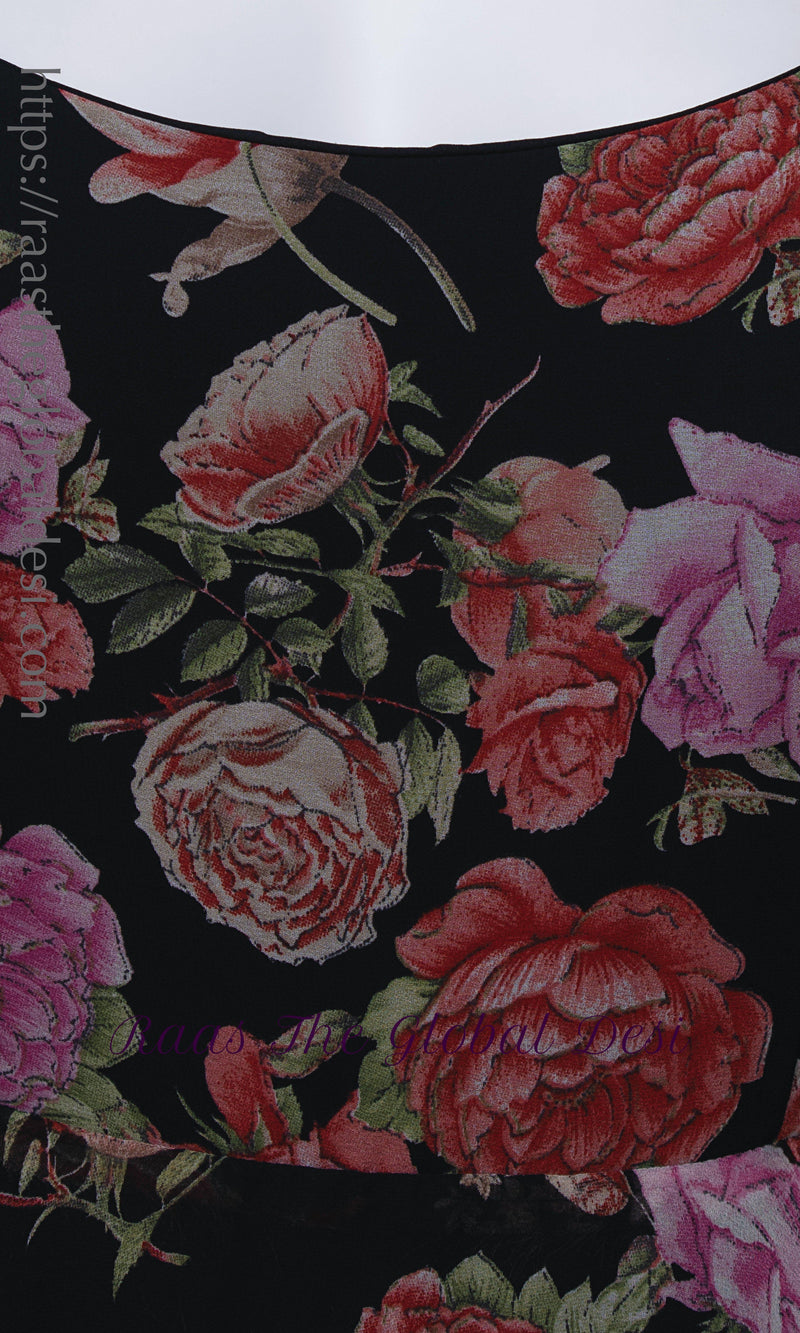 Black georgette long dress with vibrant magenta and purple ikat-inspired floral print and square neckline.