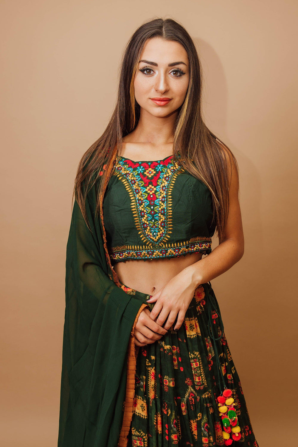 Green rayon tiered lehenga choli with embroidered blouse, dupatta, and full flare skirt for Garba styles.