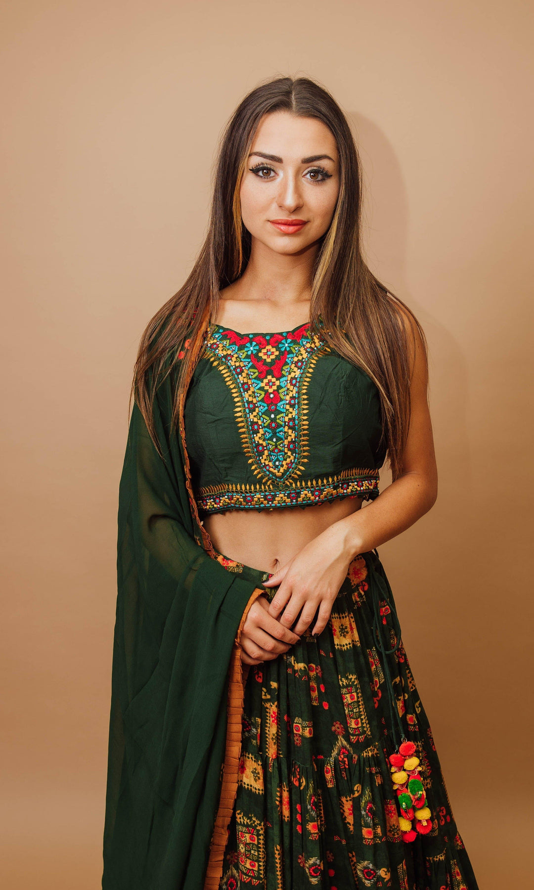 Green rayon tiered lehenga choli with embroidered blouse, dupatta, and full flare skirt for Garba styles.