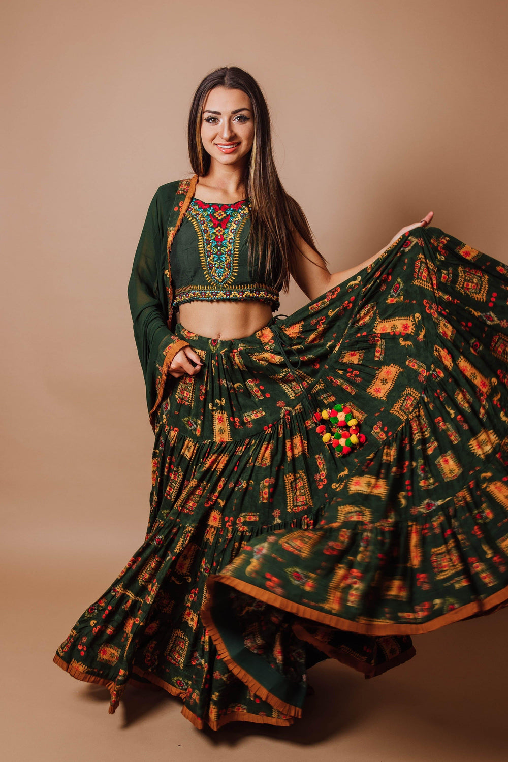 Green rayon tiered lehenga choli set with hand embroidery, perfect for Garba and festive occasions.