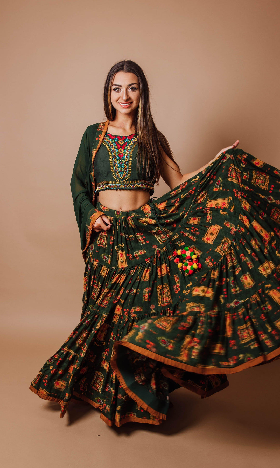 Green rayon tiered lehenga choli set with hand embroidery, perfect for Garba and festive occasions.