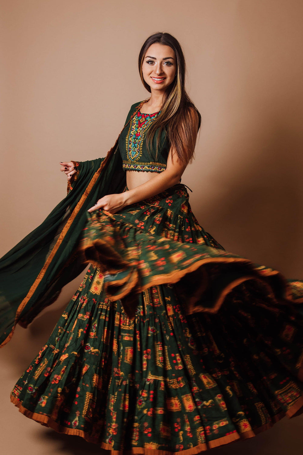 Green rayon tiered lehenga choli set with hand embroidery, full flare, and dupatta, perfect for Garba.