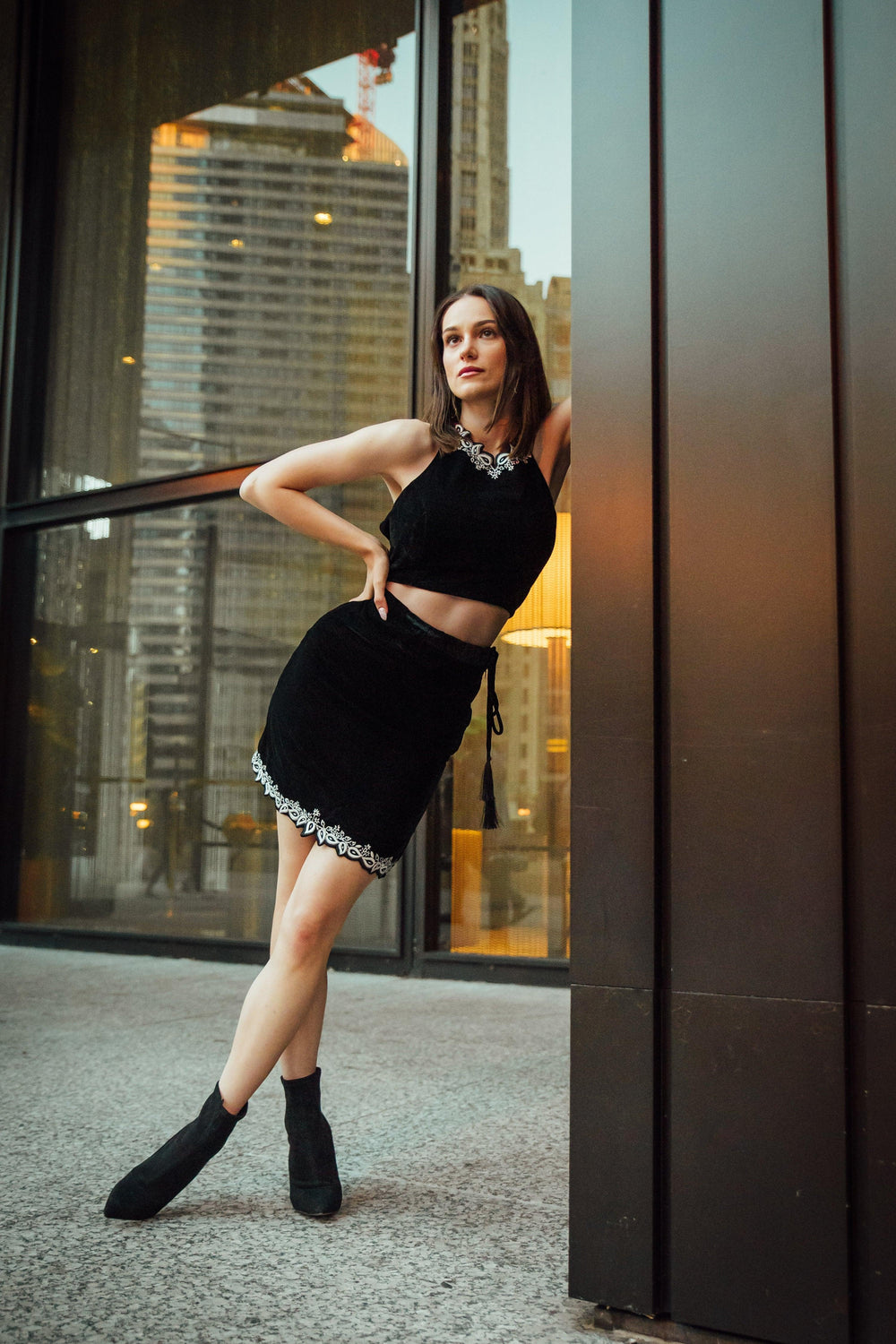 Luna black velvet mini two-piece set with embroidered crop-top and skirt, open back.