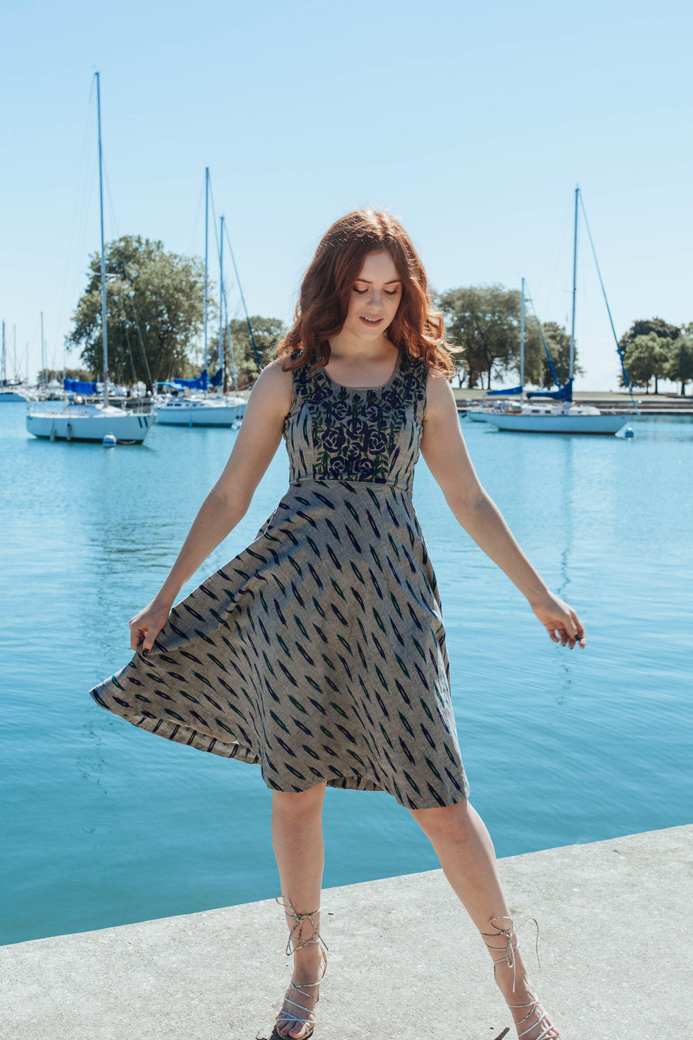 Grey cotton mini dress with embroidered neckline and torso, sleeveless, round neck, by a marina.