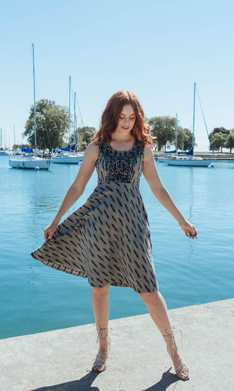 Grey cotton mini dress with embroidered neckline and torso, sleeveless, round neck, by a marina.