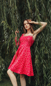 Dark pink silk one-shoulder mini dress with all-over golden hand embroidery, worn by a model.