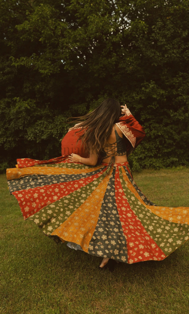 Zelie Silk Print Lehenga Choli: Woman twirling in multicolor floral silk chaniya choli with embroidered blouse.