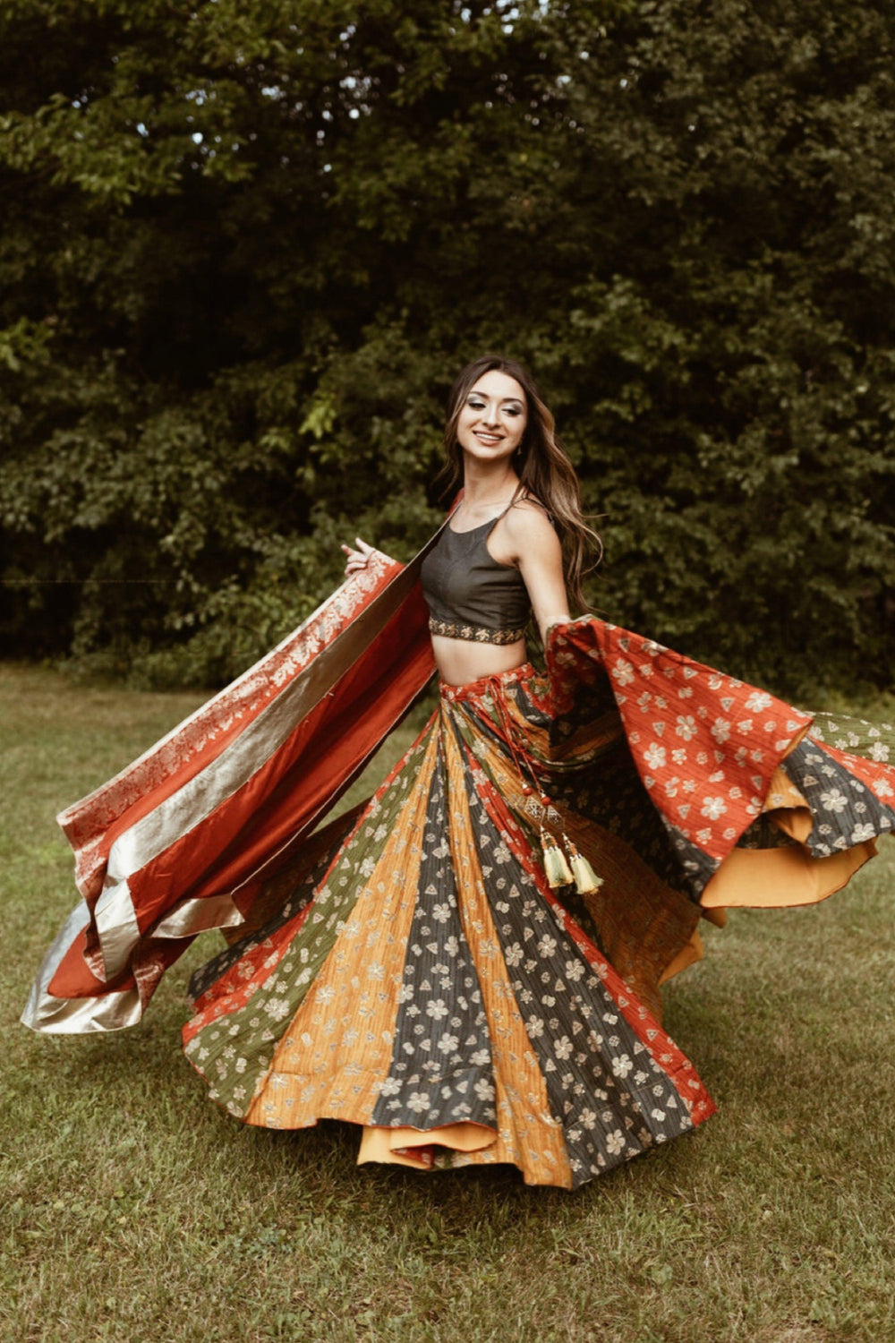 Zelie silk print lehenga choli with multicolor flare, embroidered blouse, and dupatta in a dramatic twirl.